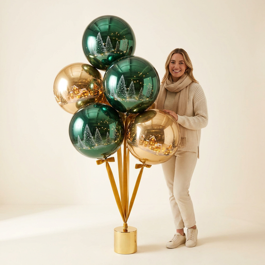 Evergreen & Gold holiday balloon bouquet in deep green and gold next to a woman for scale — Spokane and Coeur d'Alene